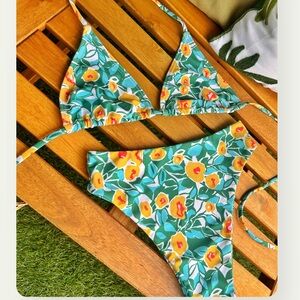 Selling this 2 piece reversible swimsuit from a local brand. Never been worn.